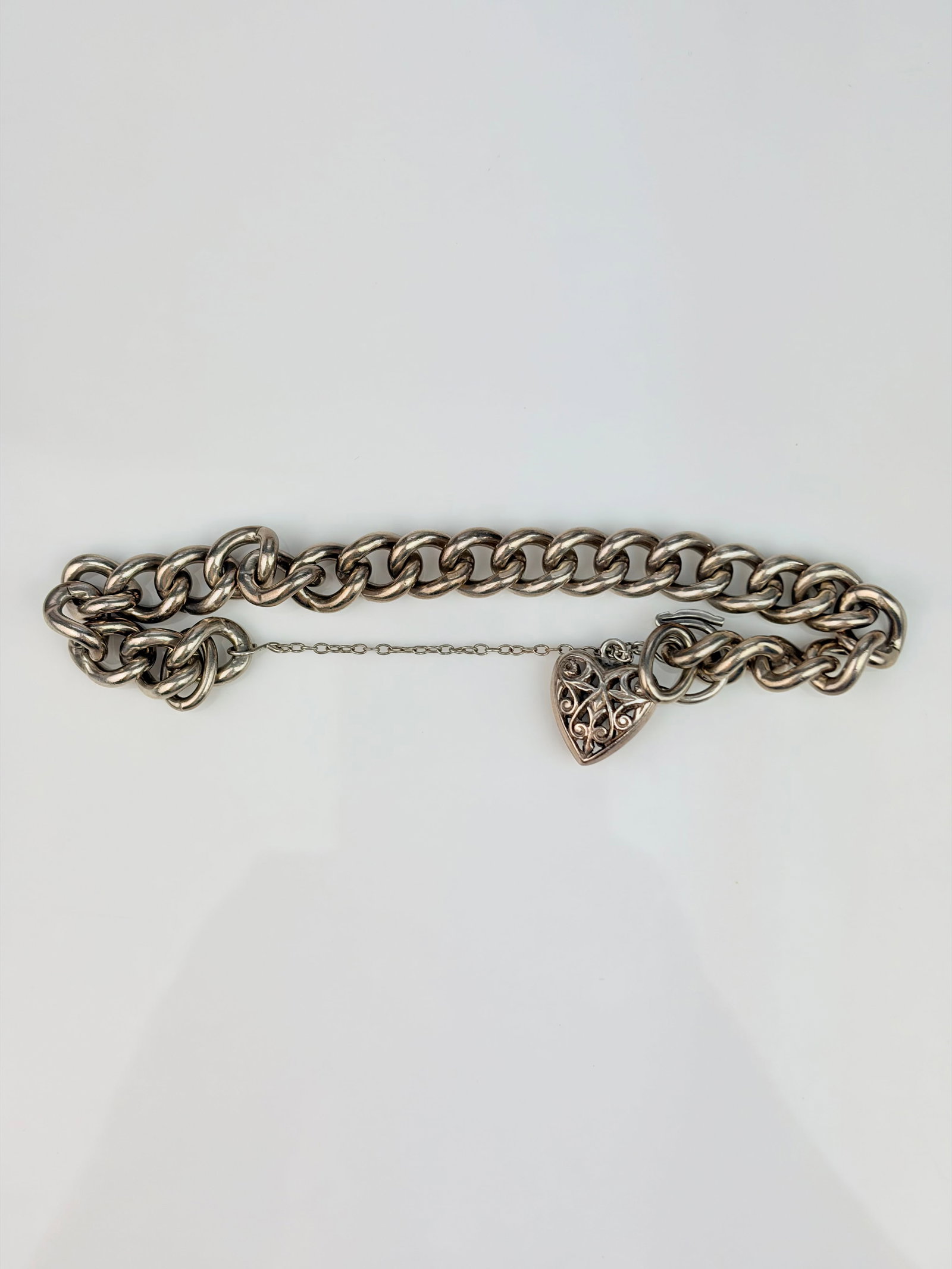 CHUNKY SILVER HEART PADLOCK BRACELET: CHUNKY SILVER HEART PADLOCK BRACELET Wonderful silver bracelet, the padlock does open, and is just stuck on the wrong link.