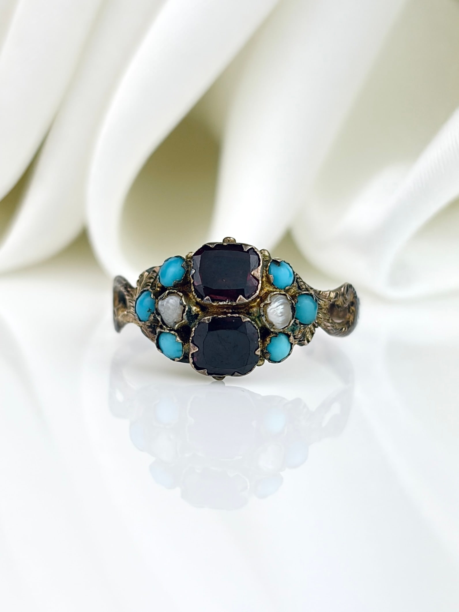 Antique c.1873 9ct Gold Flat Cut Garnet, Turquoise and Pearl Ring with Engraved Band: Antique c.1873 9ct Gold Flat Cut Garnet, Turquoise and Pearl Ring with Engraved Band Stunning in every way! A lovely combination of stones, a locket back, and an engraved band with split shoulders!