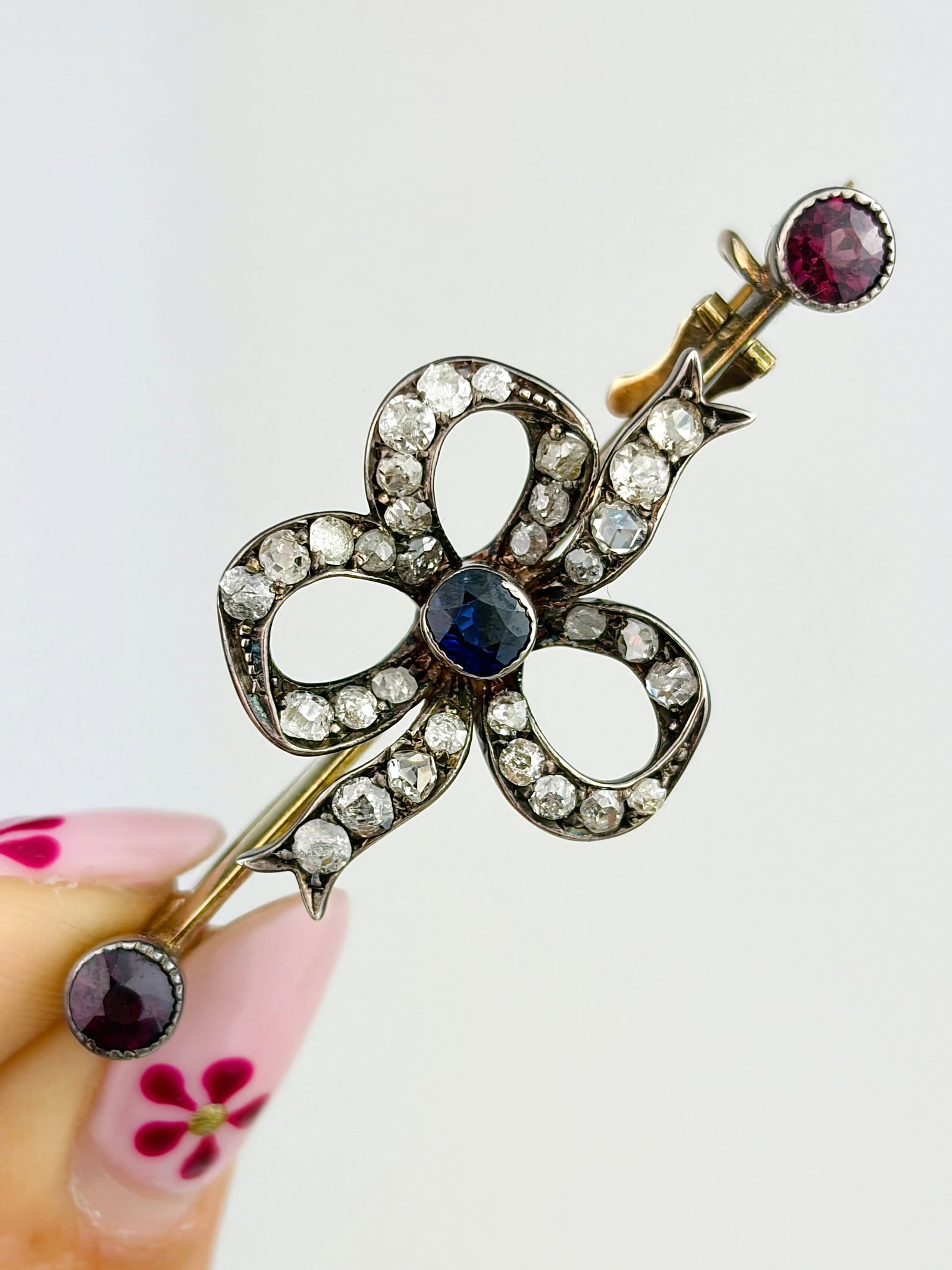 ANTIQUE ROSE CUT DIAMOND, SAPPHIRE AND ALMANDINE GARNET CLOVER BROOCH IN GOLD: ANTIQUE ROSE CUT DIAMOND, SAPPHIRE AND ALMANDINE GARNET CLOVER BROOCH IN GOLD Beautiful brooch!