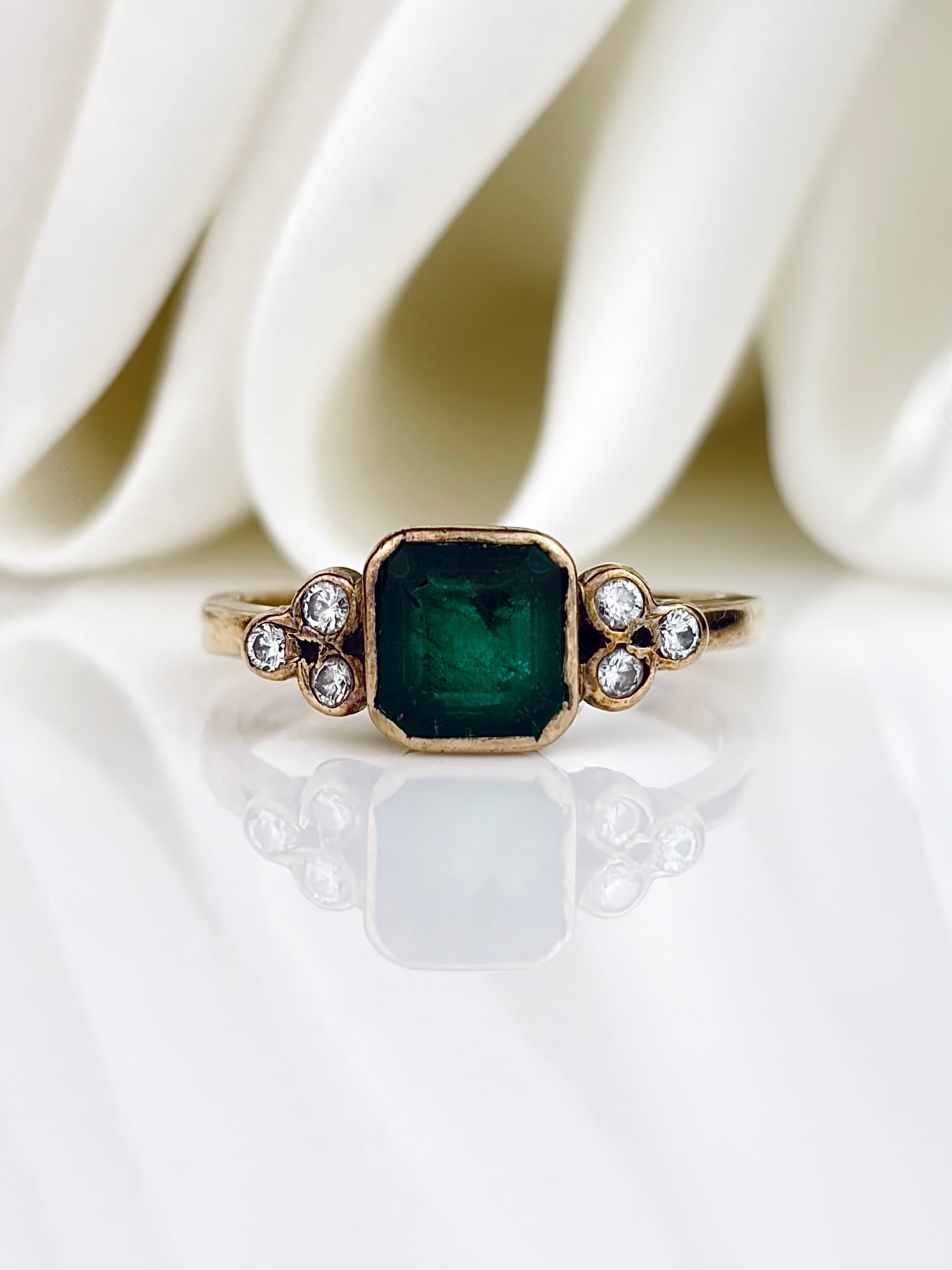 Vintage 9ct Yellow Gold Emerald and Diamond Ring: Vintage 9ct Yellow Gold Emerald and Diamond Ring gorgeous square emerald flanked by sets of three diamonds!