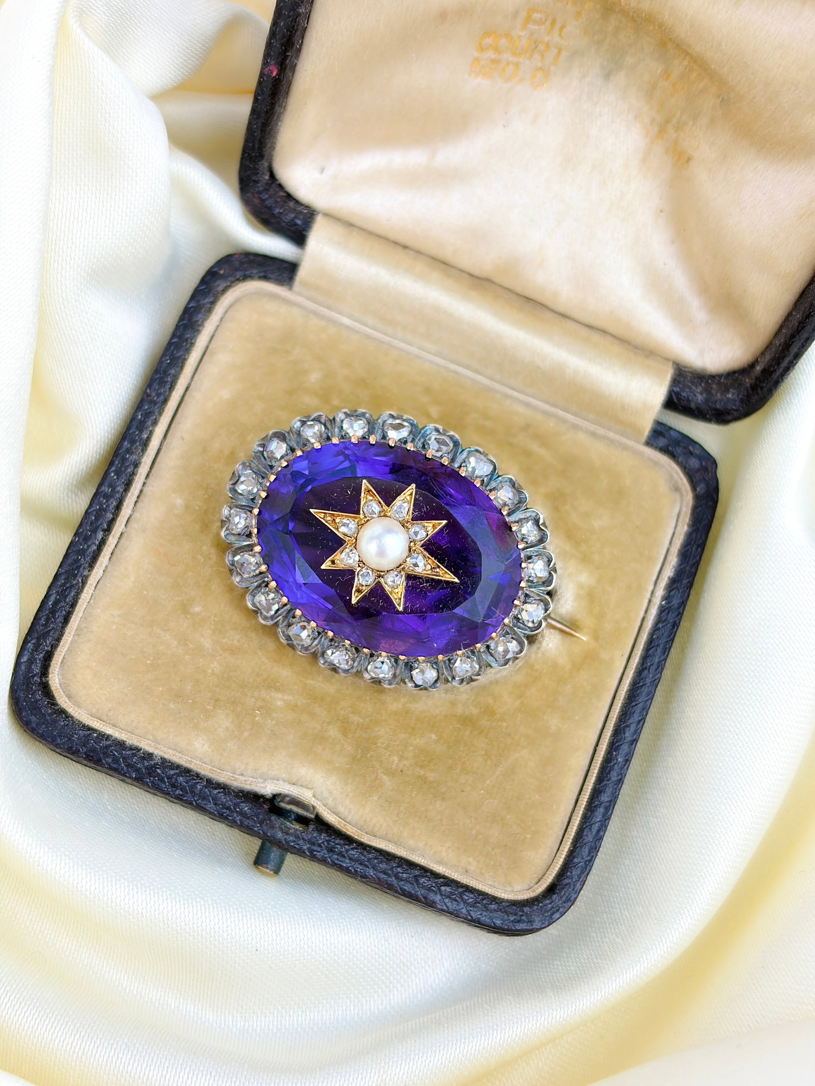 ANTIQUE BOXED VICTORIAN AMETHYST, ROSE CUT DIAMOND AND PEARL STAR BROOCH IN GOLD: ANTIQUE BOXED VICTORIAN AMETHYST, ROSE CUT DIAMOND AND PEARL STAR BROOCH IN GOLD Absolutely breathtaking brooch. With every catch of light it shines like no other, with its rose cut diamonds that fram