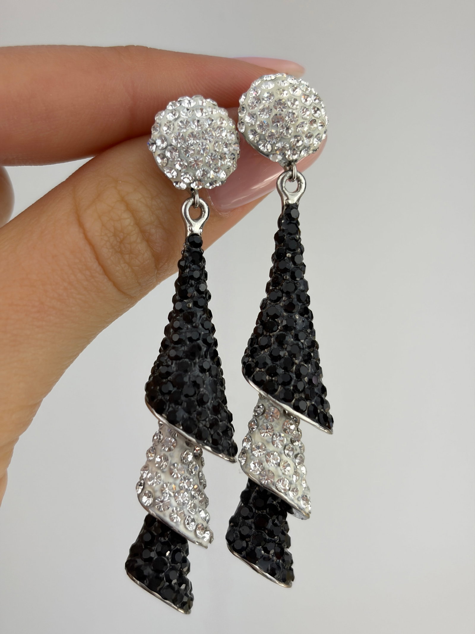 BUTLER & WILSON CRYSTAL THREE TIES CONE DROP EARRINGS: BUTLER & WILSON CRYSTAL THREE TIES CONE DROP EARRINGS Weight: 17g Size: 65x12mm Condition: Good overall condition. Some signs of wear are expected given the piece’s age. Please refer