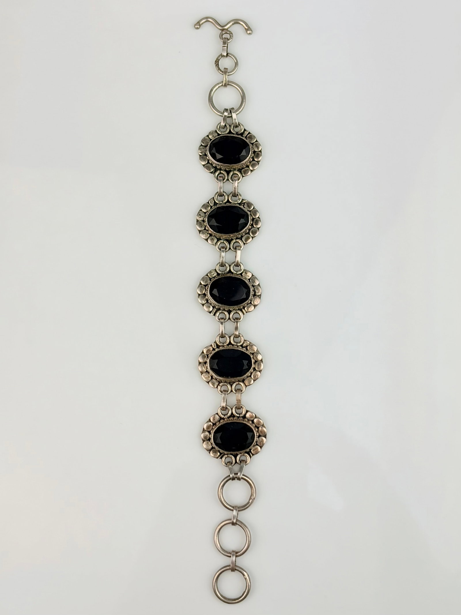 STERLING SILVER PURPLE STONE BRACELET: STERLING SILVER PURPLE STONE BRACELET Weight 31.5g Length 20cm, width 21mm Hallmarked 925