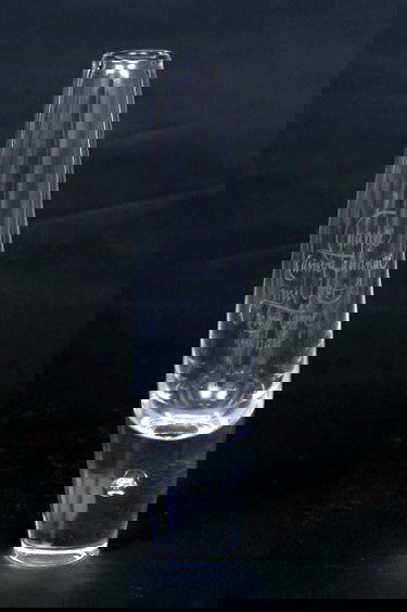 Steuben Teardrop Bud Vase: Inscribed in calligraphy "Chance cannot change my love nor time impair", by Robert Browning from "Any Wife to Any Husband", signed in script Steuben. 8"H. Condition: excellent, no damage or repair.