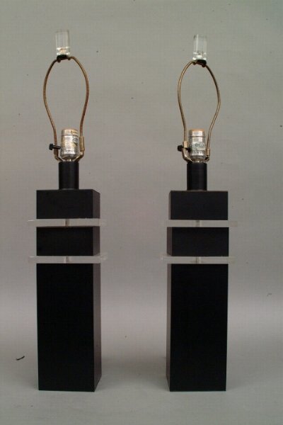 Pair of Metal and Lucite Lamps: Pair of Metal and Lucite Lamps Pair of Metal and Lucite Lamps Possibly by Karl Springer, each square form enameled in black, inset with clear lucite spacers, surmounted by cylindrical lucite finials.