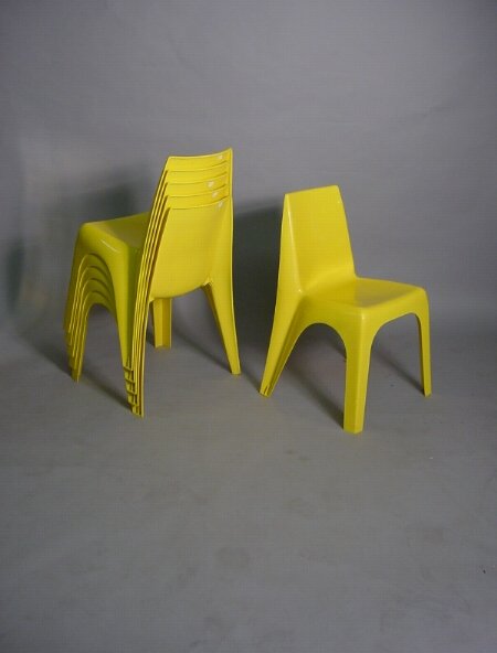 6 Stacking Yellow Borgwarner Pop Chairs: 6 Stacking Yellow Borgwarner Pop Chairs In the style of Helmut Batzner 30"H., 17"w., 15" d Condition: good.