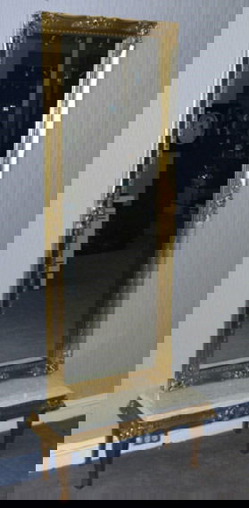 Halle's Pier Mirror and Table: The small gilt table surmounted by a cream colored marble top, with matching gilt pier mirror. Table 14"H. 31 1/2"W. 13"D. Mirror 65"H. 25 1/2"W. Condition: good.