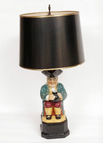 Whimsical Toby Jug Lamp: Modeled as a portly gent seated with a jug of ale, wearing a tri-corner hat, green coat, yellow waist coat, and red pants. 15 3/4"H. (base to top of jug). Condition: excellent, no damage or repair.