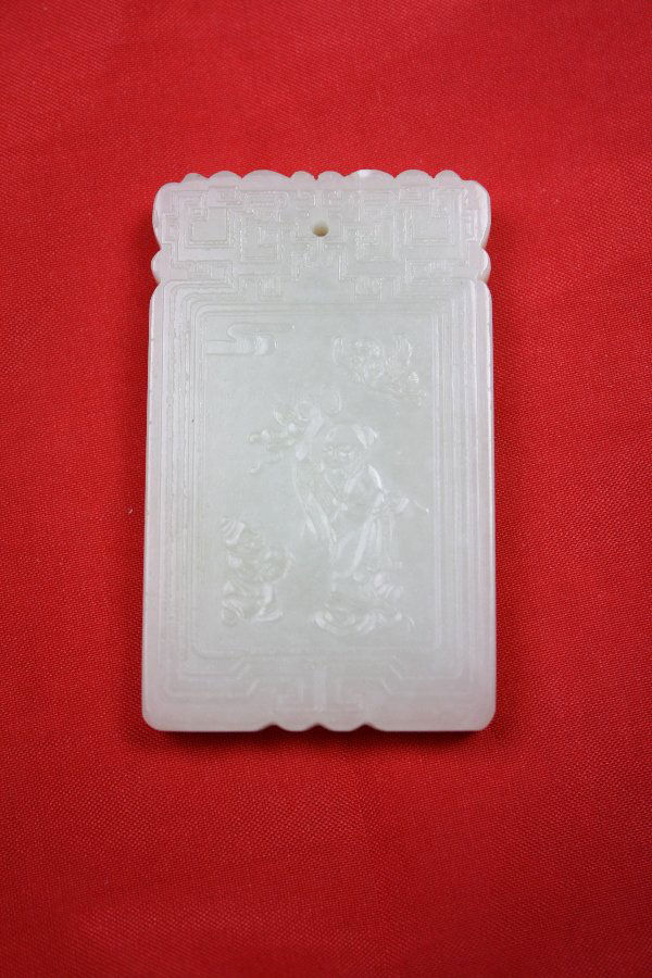 Chinese white jade pendant: Chinese white jade pendant carved figure with calligraphy at the back. H 2.4" x W 1.4".