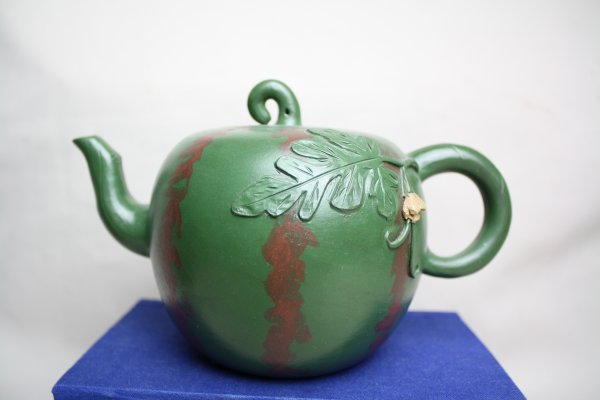 Chinese Yixing Teapot: A rare yixing watermelon shape teapot signed GAO JIAN FANG. H 4.4" x W 7.4''.
