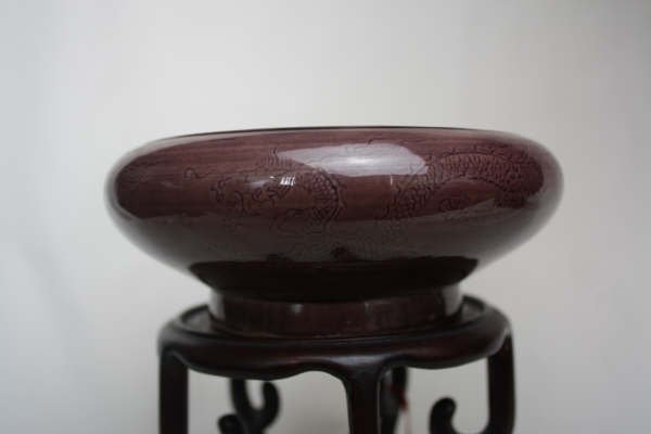 Chinese Brown Glazed Porcelain Brush Washer: A Chinese brown glazed porcelain brush pot, carved light relief dragon with mark. Circa 19-20 century. 2.2" x 5.5".