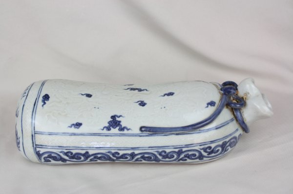Chinese Blue and White Porcelain Pillow: A Chinese blue and white porcelain pillow, decorate with light relief dragon. Xuande mark. Circa 19-20 century. H 3.4" x W 13"
