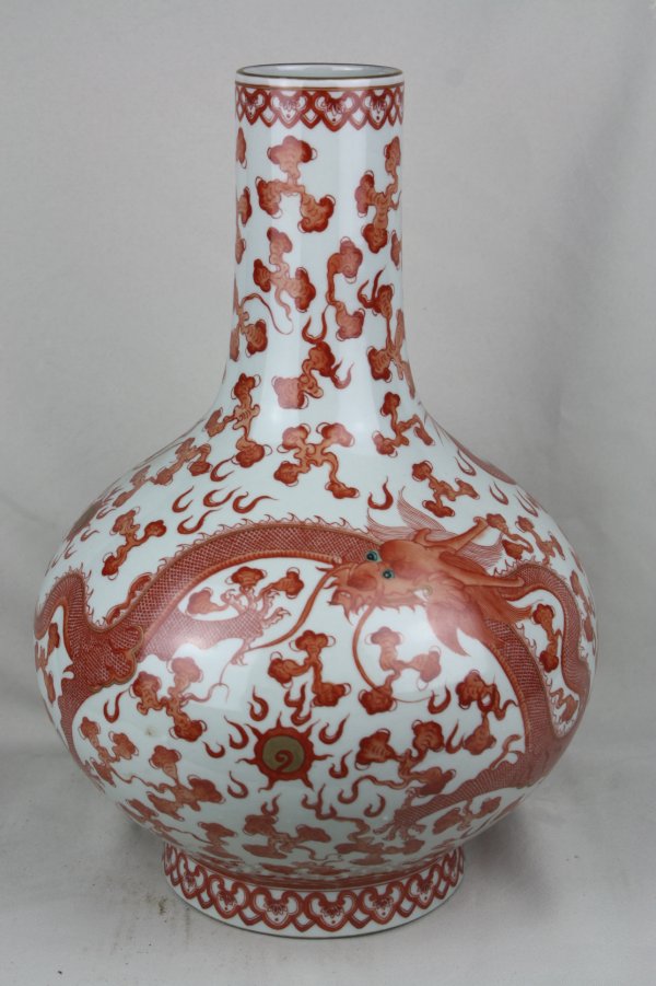Chinese Iron-red Porcelain Vase: A Chinese iron-red porcelain vase, decorated with dragon. Guangxu mark. Circa 19-20 century. H 14.3" x W 9.5"