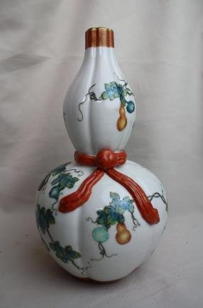 A Chinese Famille-rose Double-gourd Porcelain Vas: A Chinese famille-rose double-gourd porcelain vase, decorate with floral and bats. Yongzheng mark. Circa 19-20 century. H 9.6" x W 5.2".