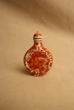 Chinese Copper-red Porcelain Snuff Bottle: A Chinese dragon copper-red porcelain snuff bottle. Qianlong mark. H 2.5" x W 1.6".