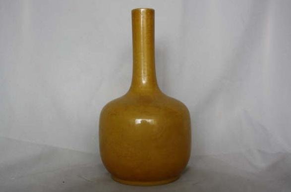 Chinese Yellow Glazed Porcelain Vase: A Chinese yellow glazed porelain vase, carved light relief dragon. Daoguang mark. 9.4" x 5".