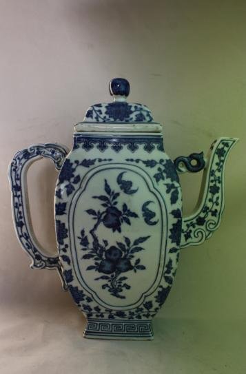 Chinese Blue and White Porcelain Teapot: A Chinese blue and white porcelain teapot, decorate with fruit, floral and bats. Qianlong mark. Circa 19-20 century. H 10" x W 9".