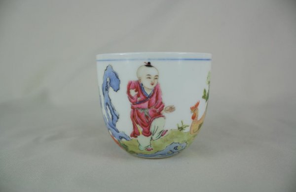 Chinese Famille Rose Porcelain Cup: A fine and rare famille rose chicken beaker cup, decorate with figural and birds. 2.7" x 3.2".
