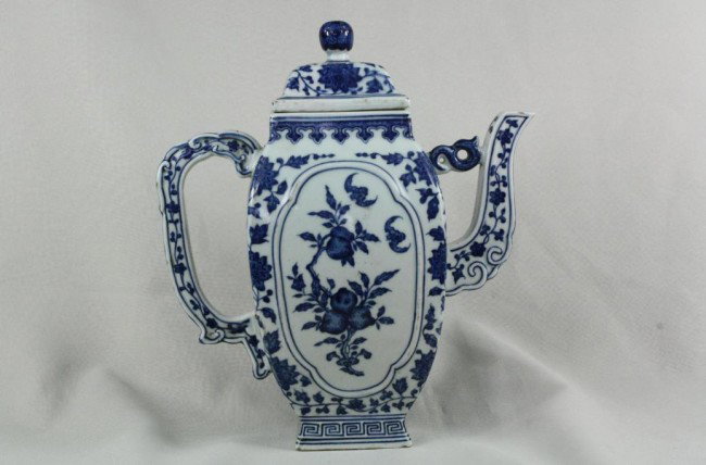 Chinese Blue and White Porcelain Teapot: A Chinese blue and white porcelain teapot, decorate with fruit, floral and bats. Qianlong mark. 10" x 9".