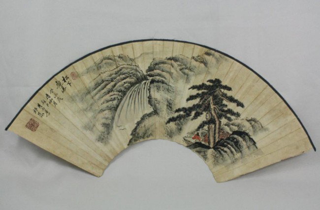 Chinese Fan Painting: Chinese fan painting, ink and color on paper, 20th century, featuring a majestic mountain landscape with figures on a cliff overlooking a misty valley, left top with a short colophon with a cyclical d