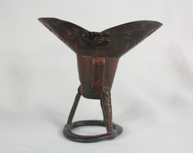 Chinese Archaistic Horn Pen Holder: Chinese archaistic horn pen holder, of typical U shape with the exterior carved and undercut with auspicious dragons, the horn of rich mottled reddish-brown color. 4.1" x 4.5".