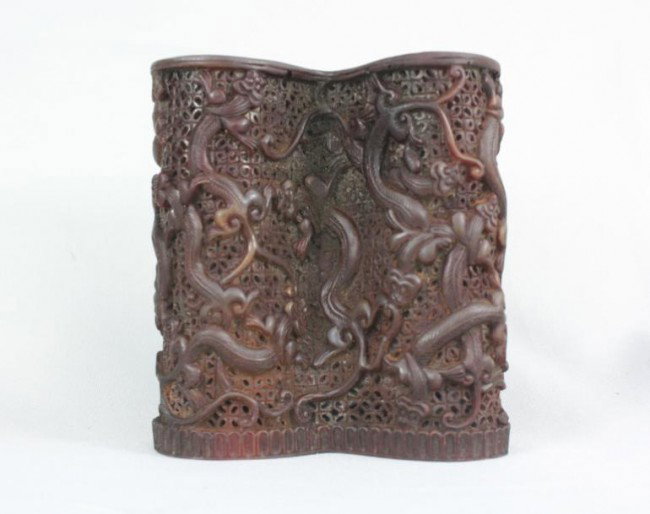 Chinese Archaistic Horn Pen Holder: Chinese archaistic horn pen holder, of typical U shape with the exterior carved and undercut with auspicious dragons, the horn of rich mottled reddish-brown color. 4" x 3.4".