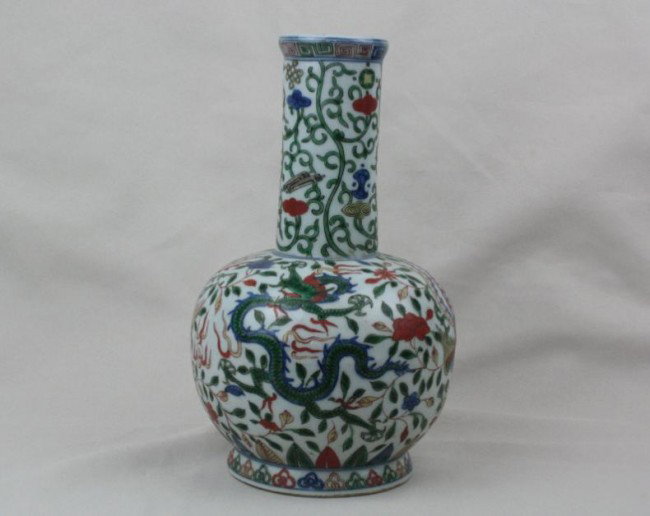 Chinese Famille Rose Porcelain Vase: Chinese famille rose porcelain vase, painted dragon and phenix with flowers borne on leafy tendrils. Wanli mark. 9.6" x 5.4".