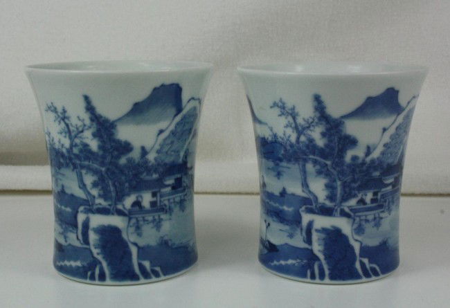 A Pair of Chinese Blue and White Porcelain Brush: A Pair of Chinese blue and white porcelain brush pot, decorated with landscape and mountains . Kangxi mark. 3.4" x 3.2".