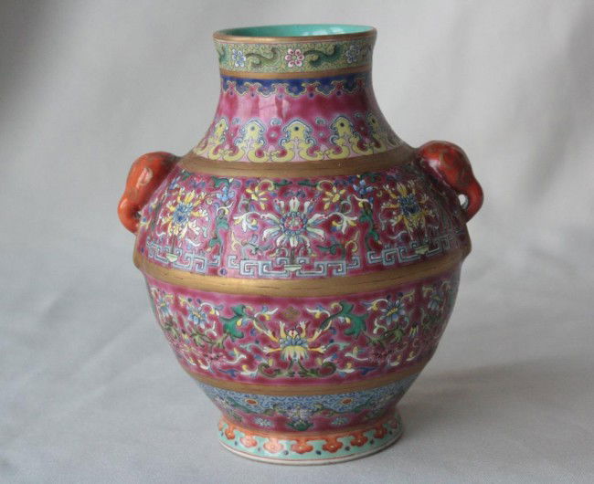 Chinese Famille Rose Porcelain Vase: Chinese famille rose porcelain vase, the main body brilliantly painted with luxuriant lotus flowers, the flourishing petals painted in delicate tones of blue, pink, yellow and red, surrounded by conti