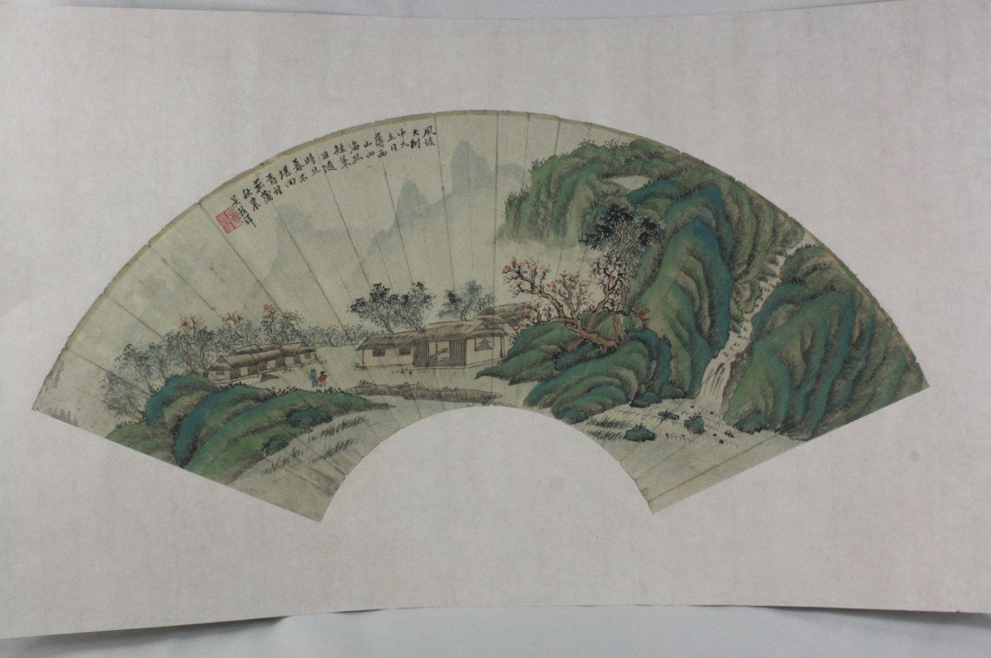 Chinese Fan Painting: Chinese fan shape painting, ink and color on paper, 20th century, featuring a river with majestic mountain landscape, the top with a short colophon and signature, with one seal. 9" x 21".