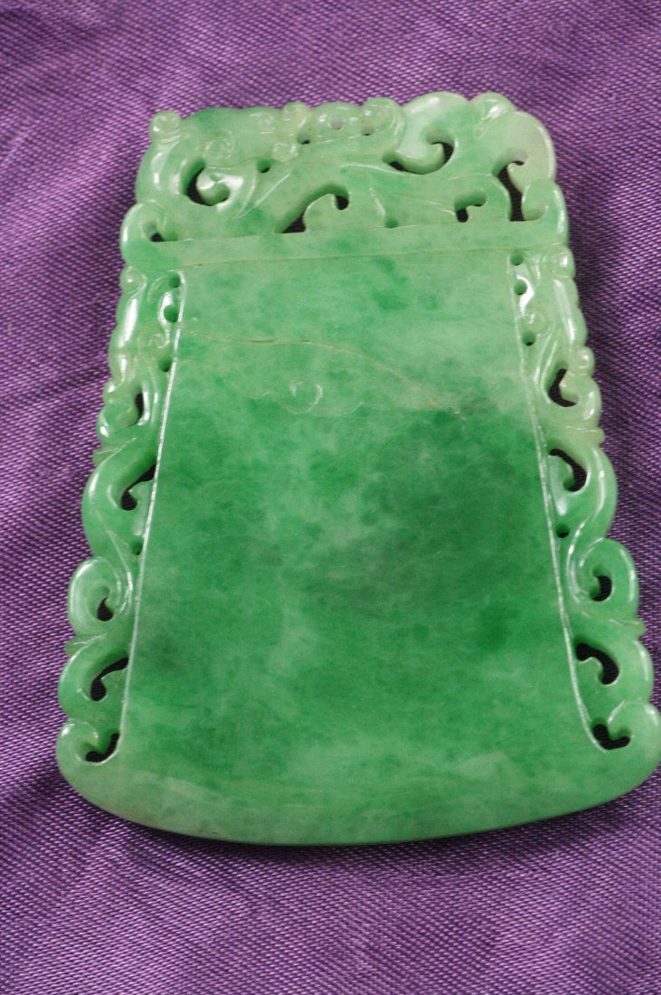 Chinese Jadeite Pendant: A Chinese jadeite pandant carved axe, decorated with dragon on the top. 2.5" x 2.1".