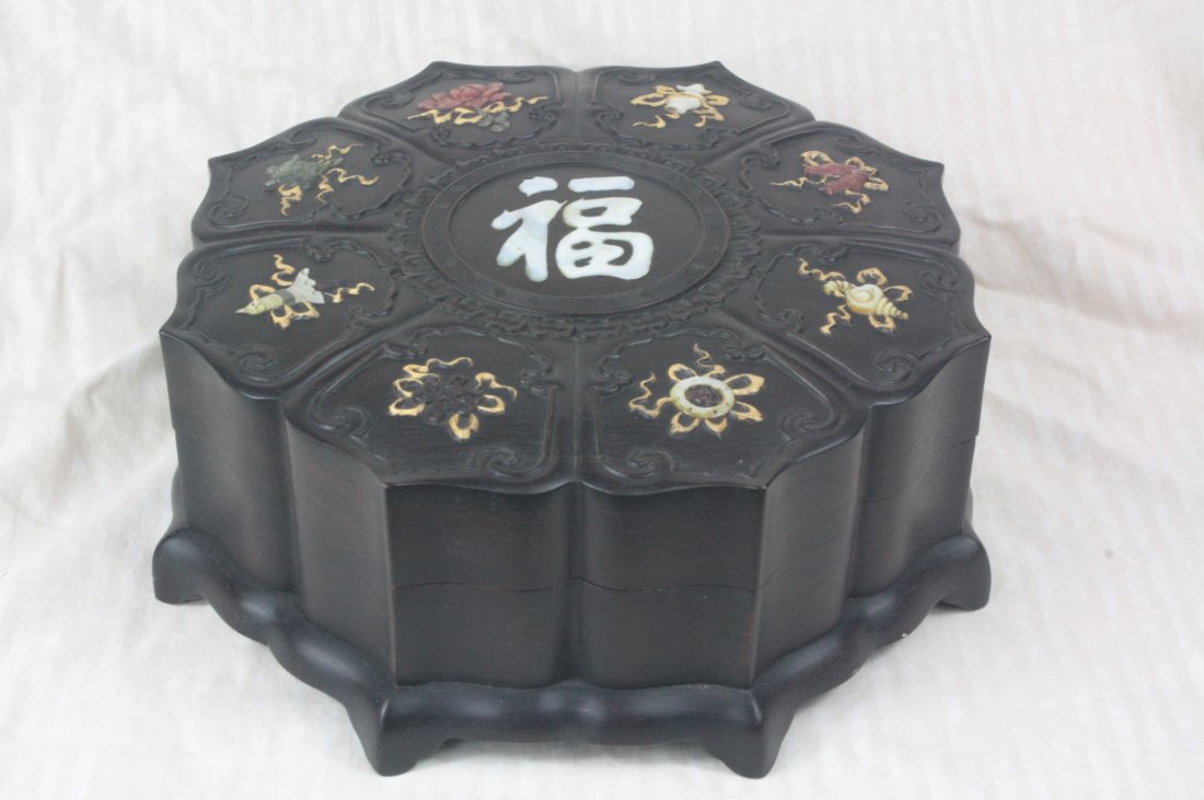 Chinese carved Zi-Tan Wood Box: Chinese carved Zi-Tan wood box shaped as a lotus flower. Depicting floral and objects with jade, Seashell and stone. 3.8" x 9.9".