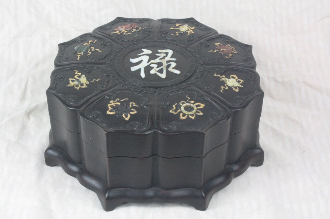 Chinese carved Zi-Tan Wood Box: Chinese carved Zi-Tan wood box shaped as a lotus flower. Depicting floral and objects with jade, Seashell and stone. 3.8" x 9.9".