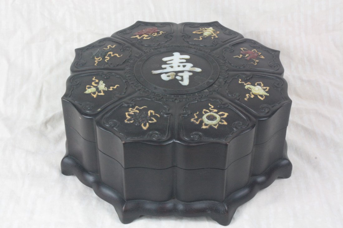 Chinese carved Zi-Tan Wood Box: Chinese carved Zi-Tan wood box shaped as a lotus flower. Depicting floral and objects with jade, Seashell and stone. 3.8" x 9.9".
