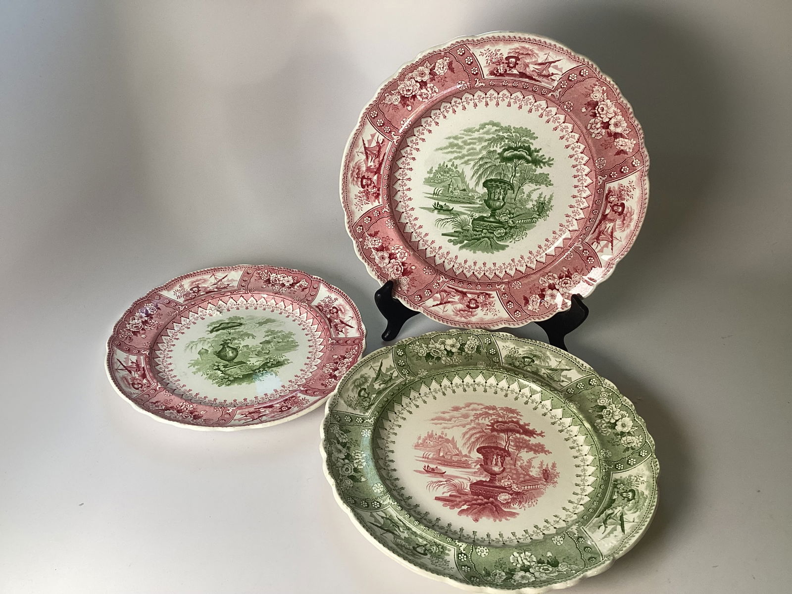 T Mayer Staffordshire CANOVA Pink and Green Bicolored Plates: Dinner plates are 10.25"; salad plate is 9". 1 dinner plate with faint hairline. Rare pink and green color combination. Includes 2 dinner plates and 1 salad.