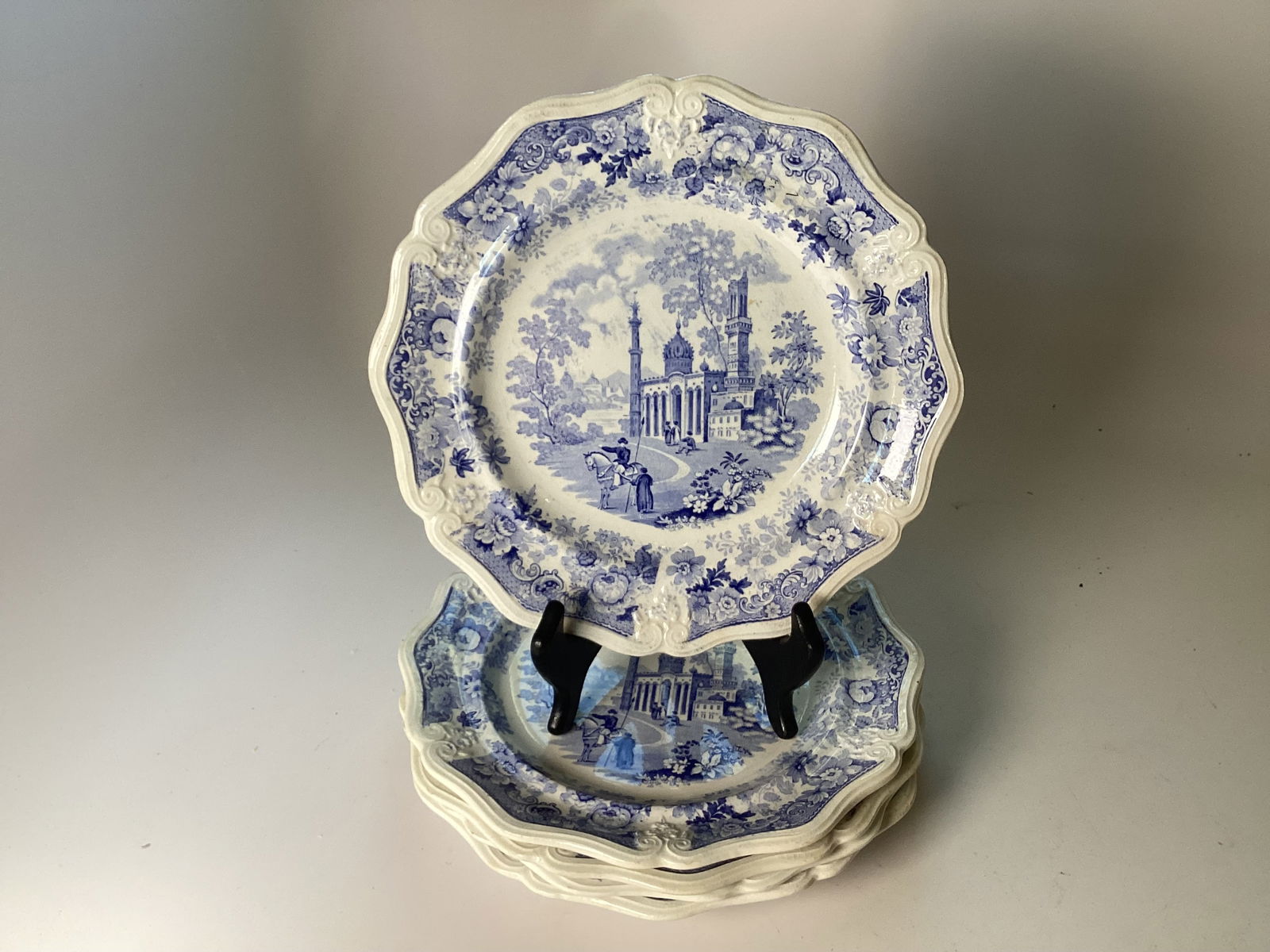 5 English Staffordshire Blue Transferware ASIATIC BEAUTIES Salad Plates: 8.5" wide. Very good condition. Each molded with a raised scalloped border centering figures in a Persian inspired landscape.