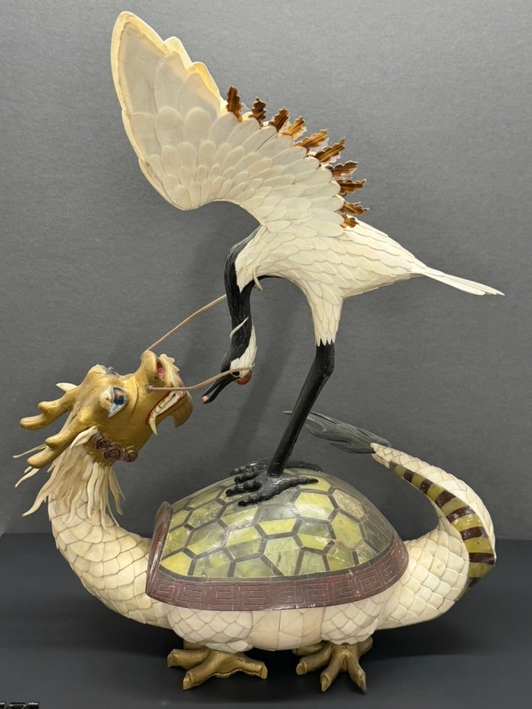 Japanese or Chinese 20th century 19" tall statue of a crane on a dragon tortoise Very unique: This piece is very unique and made entirely by hand of natural materials. The scales of the dragon tortoise and the feathers of the crane are carved from bone. The cranes legs, and feet as well as the