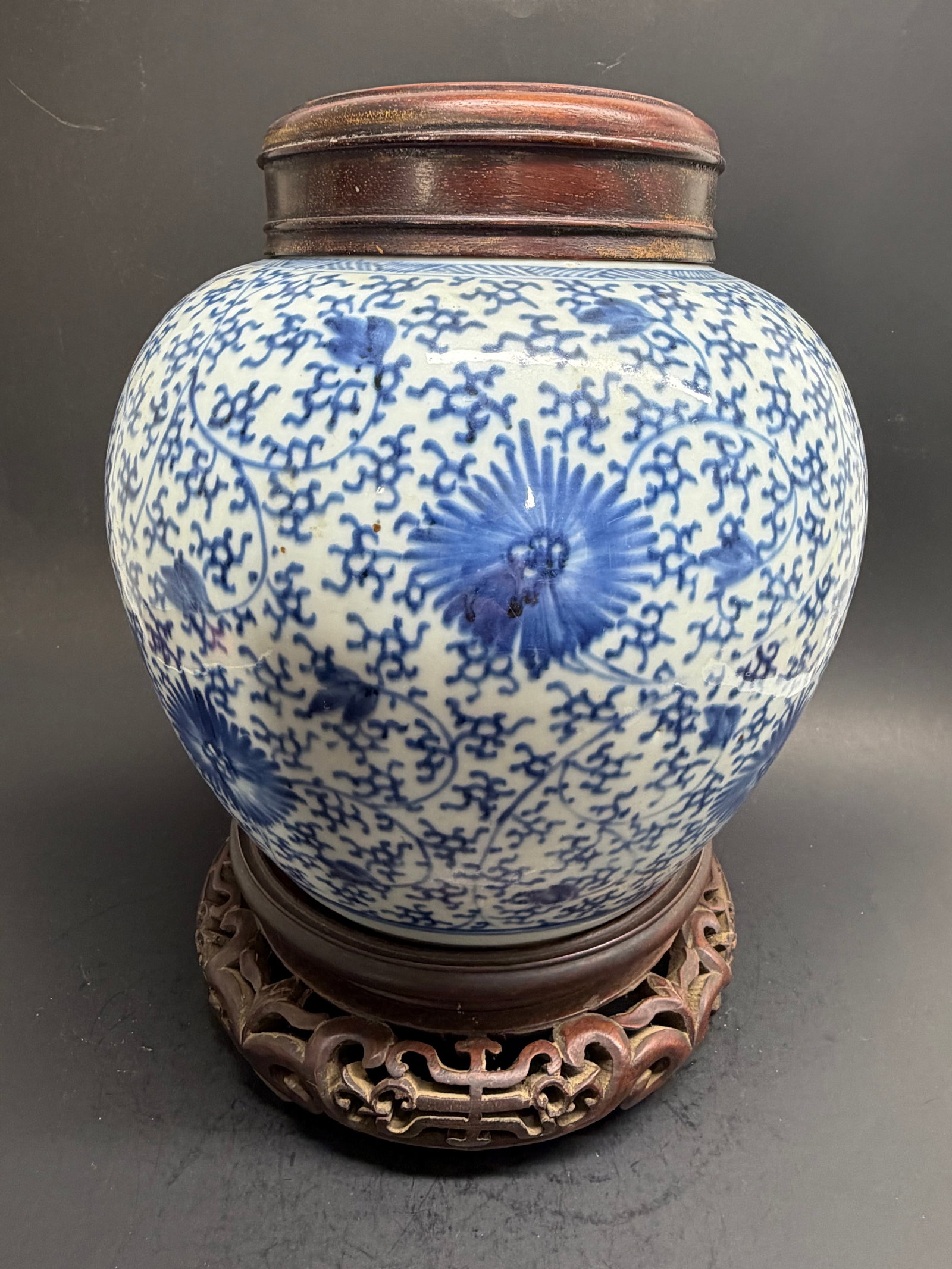 Chinese Qing Dynasty Porcelain Blue and White Jar with wood lid and stand: Chinese Qing Dynasty Porcelain Blue and White Jar with wood lid and stand 11'' tall with stand lid, 7 3/4" without. 9" wide at shoulder.