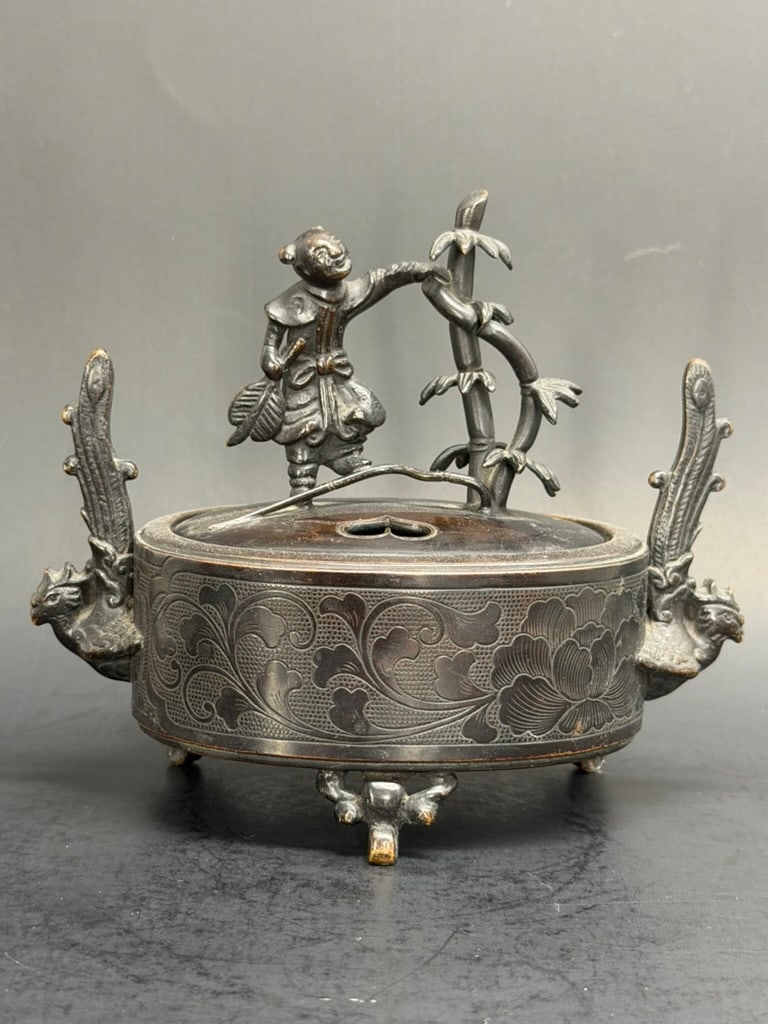 Japanese Edo Period Bronze Koro featuring a Karako signed Kamada Yosuke for Kinsai: Very Unique Japanese Edo Period Bronze Koro featuring a Karako signed Kamada Yosuke for Kinsai. 5'' tall by 6" long by 3 1/4" wide
