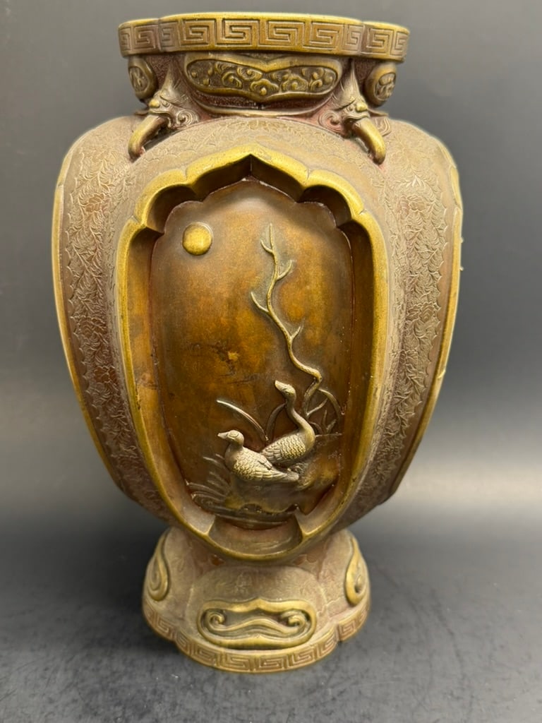 Japanese Meiji Period bronze 4 panel vase 11" tall depicting high relief birds and trees: Japanese Meiji Period bronze 4 panel 11" vase. Each panel depicting different trees and different birds. The surface around the corners are all hand tooled and engraved. 11'' tall by 7 1/2" wide