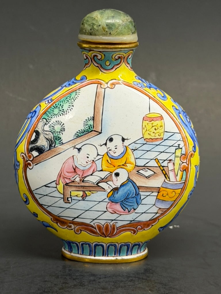 Chinese Late Qing - Early Republic Canton Enamel Snuff Bottle With Nephrite Jade / horn Stopper.: Chinese 19th - 20th Century Canton Enamel Snuff Bottle With Nephrite Jade / horn Stopper. Unknown reign mark. One side of the bottle seems to show the children studying, and the other side of the bott