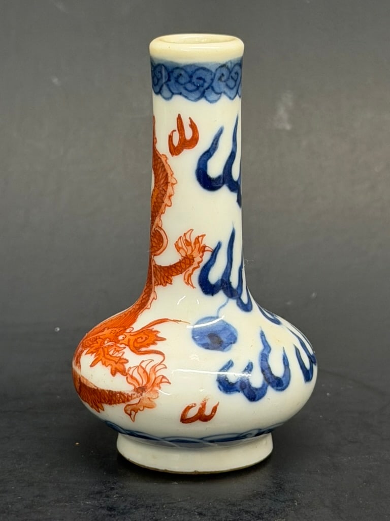 Chinese 19th Century Blue and Iron Red Dragon Snuff Bottle: Chinese 19th Century Blue, White, and Iron Red Dragon Snuff Bottle. The bottom of the bottle has a blue painted dragon. 2 1/2'' tall by 1 3/8" wide