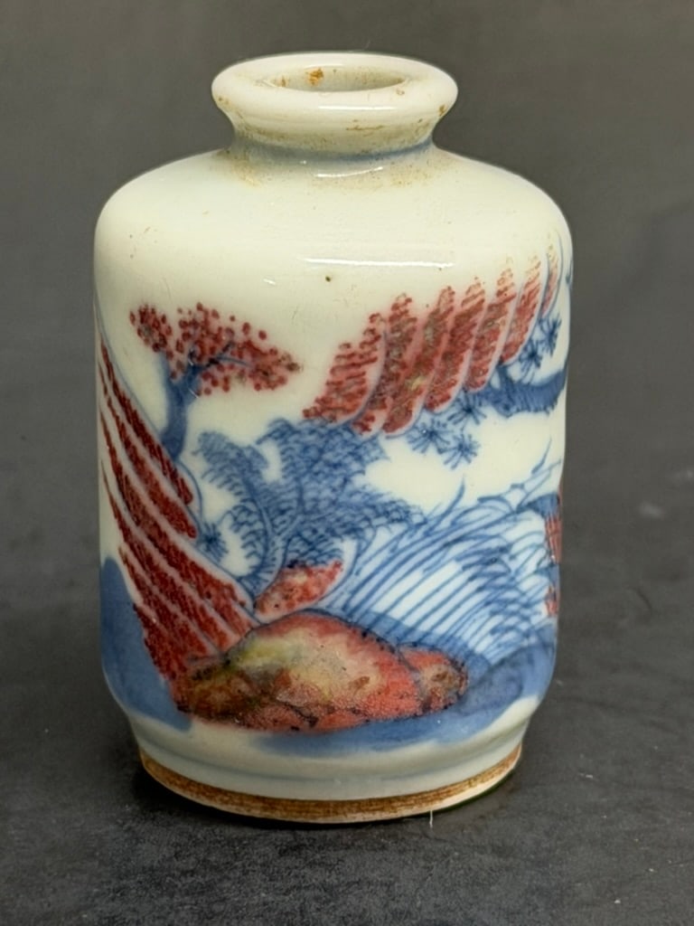 Chinese Qing Dynasty blue and Iron Red Underglaze Fishing Scene snuff bottle. 19th Century: Chinese 19th Century blue and white and Iron Red Fishing Scene snuff bottle. No stopper. 1 5/8'' tall by 1 1/8" wide.