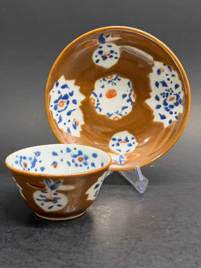 Chinese Export Porcelain Kangxi Multi colored Cafe au Lait Teacup and Saucer. Early 18th Century : Early 18th Century Chinese Export Porcelain Multi colored Cafe au Lait Teacup and Saucer Kangxi . Cup is 2 1/2" by 1 1/4" deep. Saucer is 4" by 5/8".