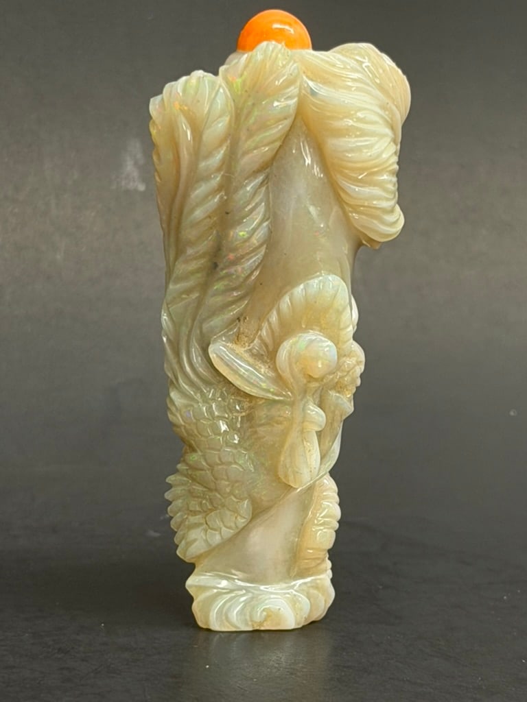 Chinese Carved Opal Dragon and Phoenix Snuff Bottle with natural Coral Stopper: Chinese Carved Opal Dragon and Phoenix Snuff Bottle with natural Coral Stopper. 2 3/4'' by 1 1/8"