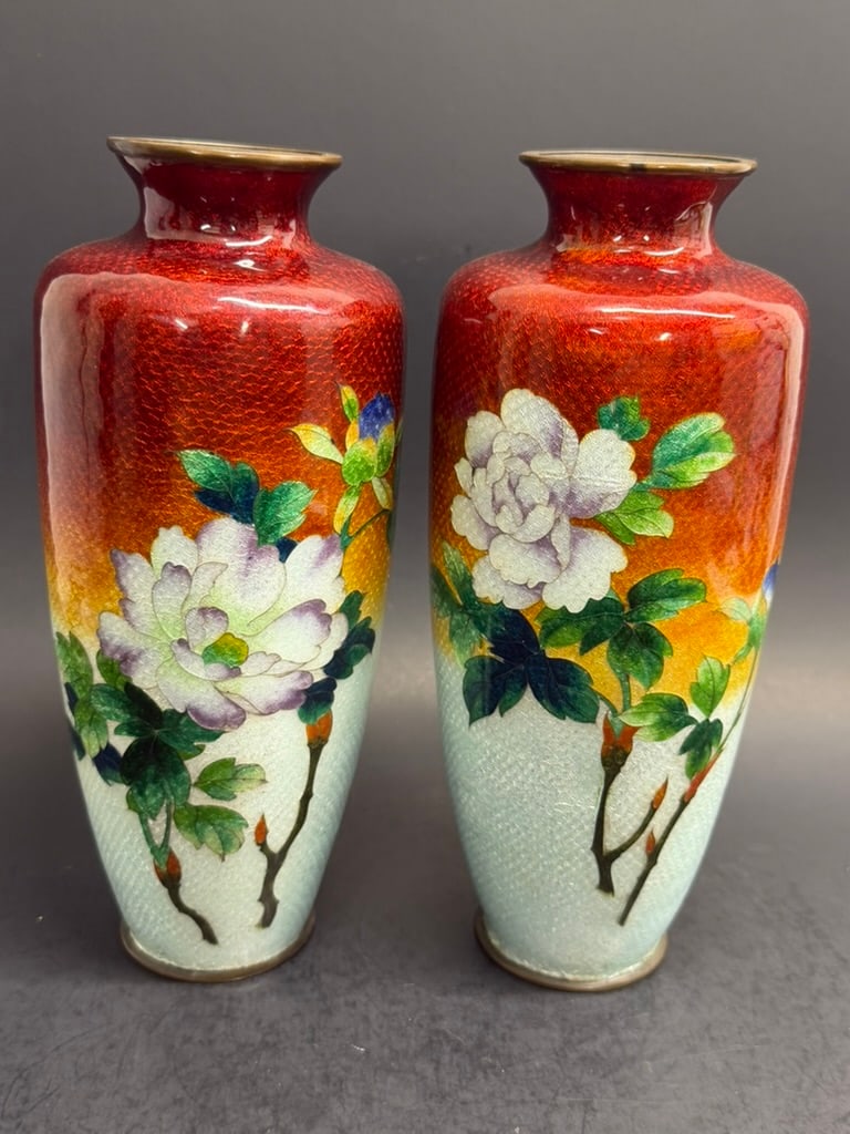 Pair of Japanese Taisho- Showa Cloisonne Ginbari Vases featuring a red to white ombre ground with bl: Pair of Japanese Taisho- Showa Cloisonne 8 3/16" Ginbari Vases featuring a red to white ombre ground with blossoming flowers 8 3/16" tall by 3 1/2" wide