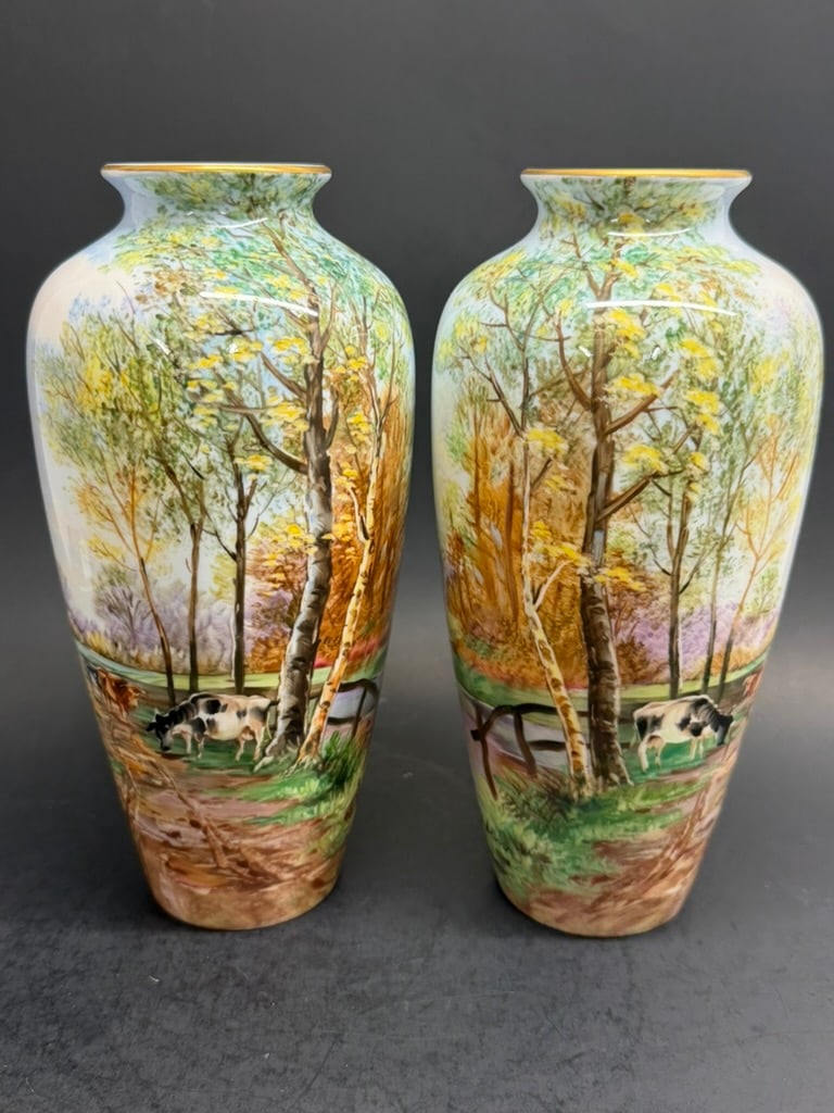 Pair of Japanese hand painted Noritake Nippon Toki Kaisha vases Signed J. Seho: Beautiful Pair of Showa period hand painted Noritake vases depicting a rural country farm scene with cows grazing and standing near a field with ponds and wooded back drop. Signed by J.Seho 8 1/2'' by