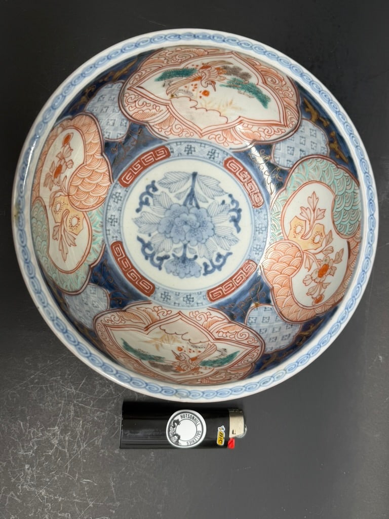 Japanese 19th Century Meiji Period Imari bowl Decorated with florals, cranes, and waves.: 19th Century Meiji Period Japanese Imari bowl Decorated with florals, cranes, and waves. 7 1/4'' by 2 3/4" deep