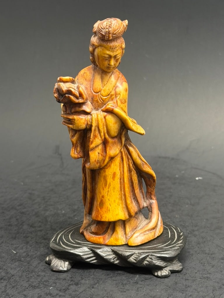 Chinese soapstone carving of Guanyin on a wood stand. (1 of 18)