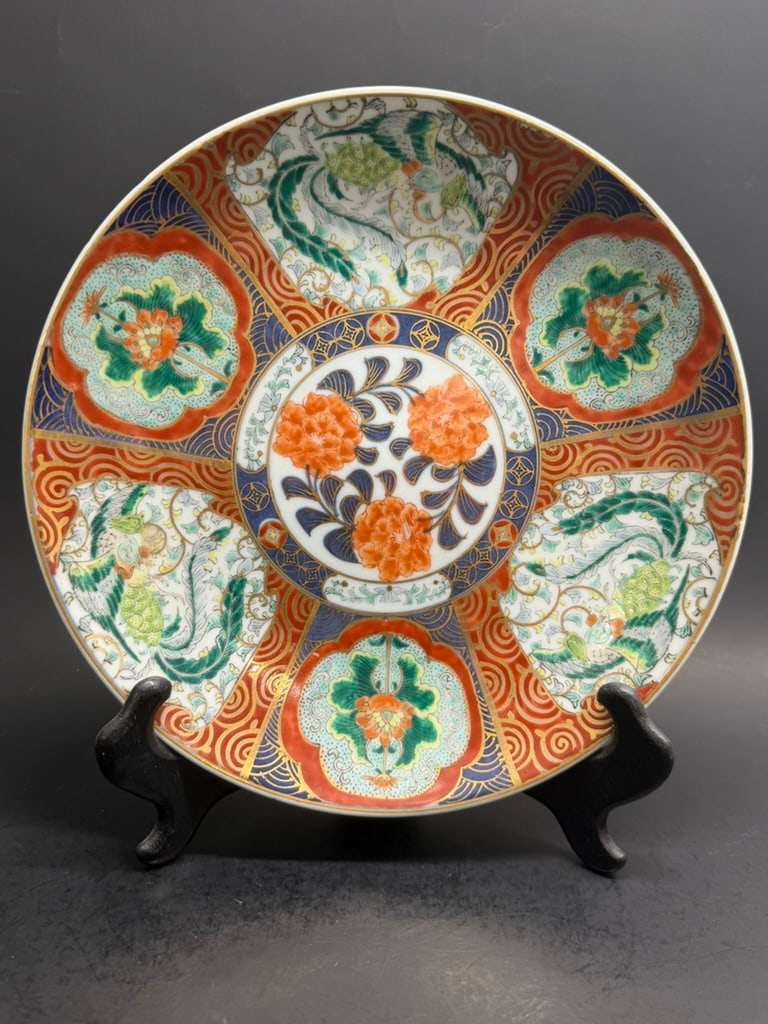Japanese Meiji Imari plate featuring floral panels as well as Phoenix panels with a large floral pan: Stunningly well decorated Japanese Meiji Imari plate featuring floral panels as well as Phoenix panels with a large floral panel in the center. Signed 9 3/4" by 1 1/4"